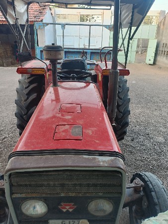 massey 1035 tractor and troli